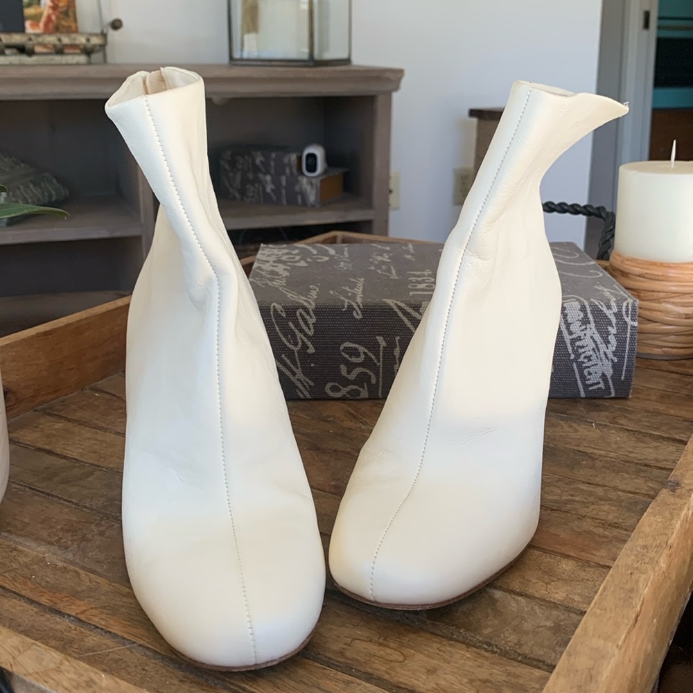 Josie 38 1/2 cream ankle booties, 3 1/2 heel, with zip up in back.